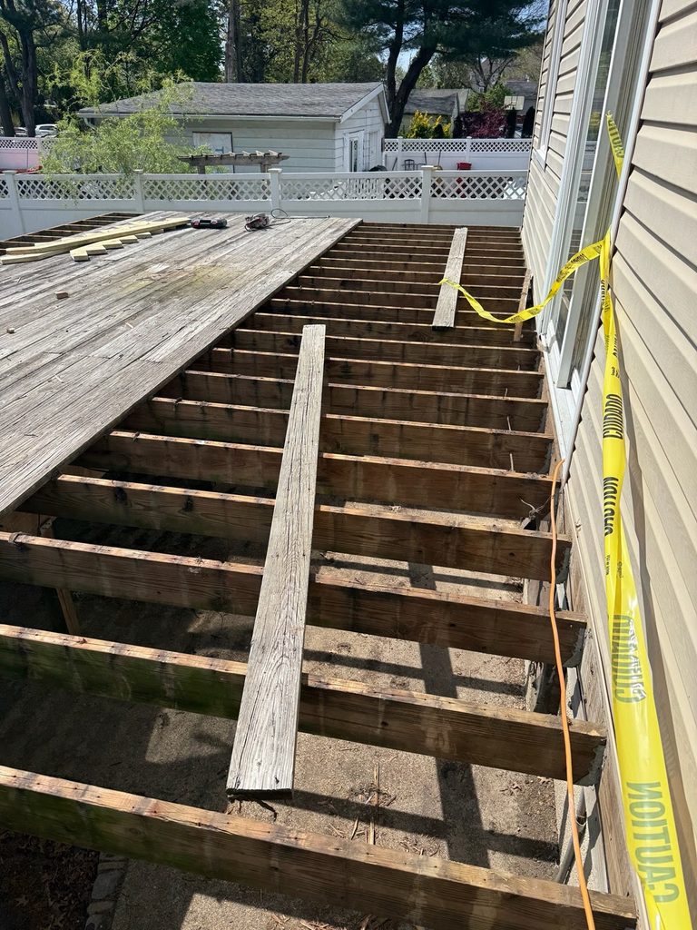 Removing the wood to prepare the new deck