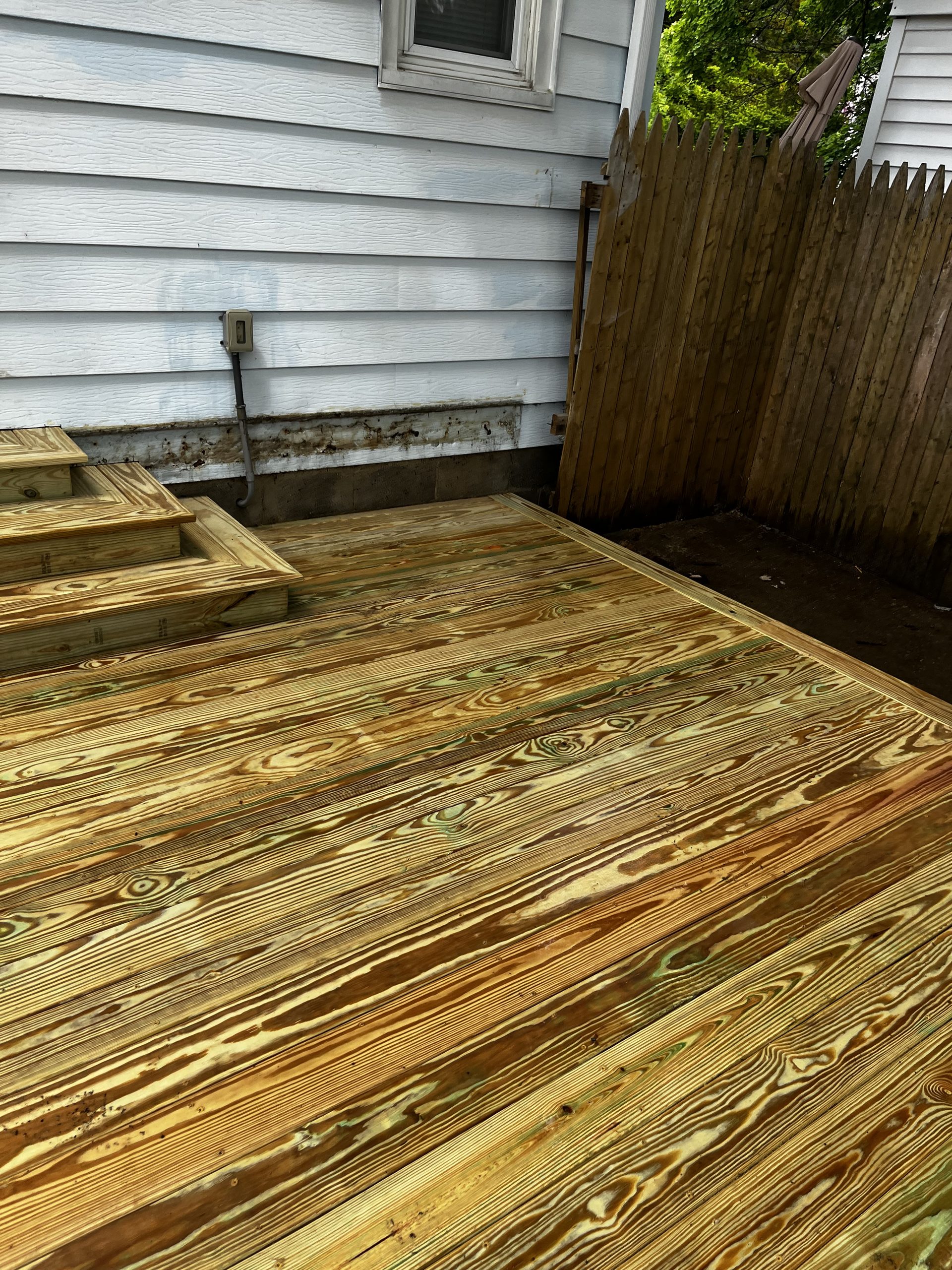 Pressure-treated wooden deck